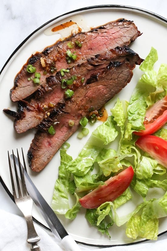 The marinade in this Grilled Asian-style Soy Marinated Flank Steak takes an uninteresting piece of steak and turns it into a mouthwatering dish!