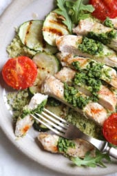 Grilled chicken, zucchini and tomatoes topped with a light spinach-arugula basil pesto served over couscous.
