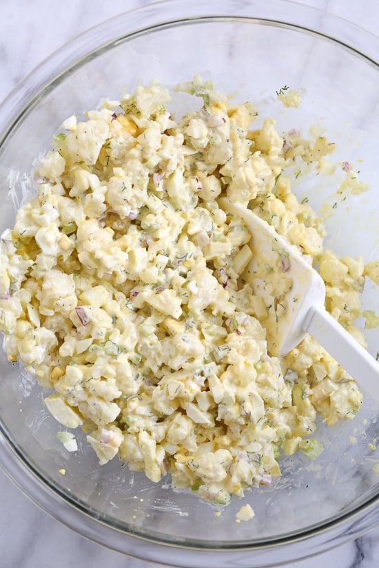 A low-carb faux "potato" salad made with cauliflower instead of potatoes, perfect for Keto or if you're just looking to eat less carbs.