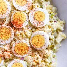A low-carb faux "potato" salad made with cauliflower instead of potatoes, perfect for Keto or if you're just looking to eat less carbs.