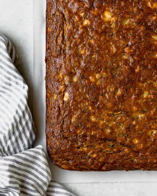 Fruity, moist and delicious, this banana and zucchini cake is loaded crushed pineapple and lightly sweetened with honey.