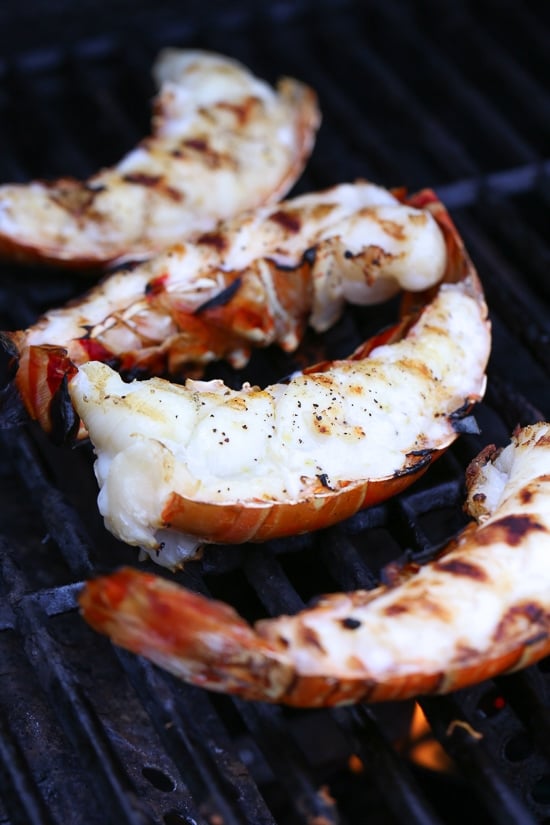 Grilled Lobster Tails topped with Herb Garlic Butter are a delicious delicacy, and grilling them is super quick and easy!