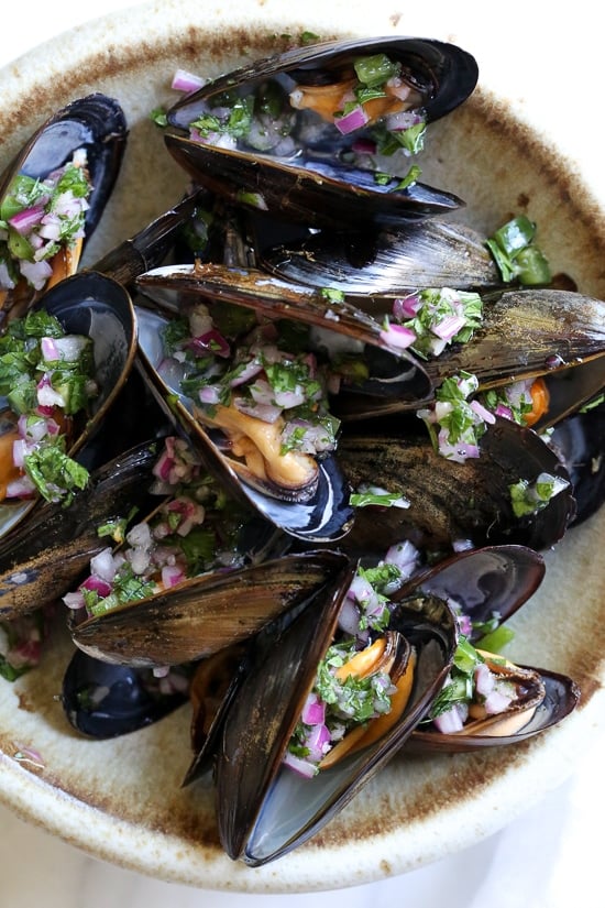 Steamed mussels get a kick with spicy Piri Piri Sauce which is basically a kicked up chimichurri sauce. 