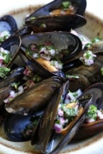 Steamed mussels get a kick with spicy Piri Piri Sauce which is basically a kicked up chimichurri sauce.