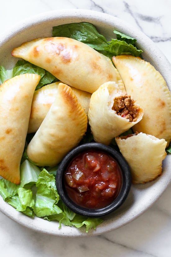 These taco empanadas are made from scratch with my ground turkey taco meat and my quick and easy pizza dough recipe!