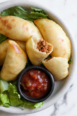 These taco empanadas are made from scratch with my ground turkey taco meat and my quick and easy pizza dough recipe!