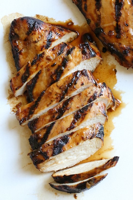 Grilled Bourbon Chicken breasts are marinaded with soy sauce, Bourbon, brown sugar, ginger and spices then grilled until slightly caramelized on the outside and juicy on the inside.