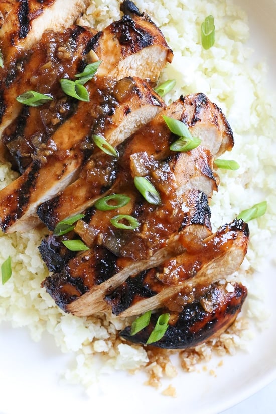 Grilled Bourbon Chicken breasts are marinaded with soy sauce, Bourbon, brown sugar, ginger and spices then grilled until slightly caramelized on the outside and juicy on the inside.