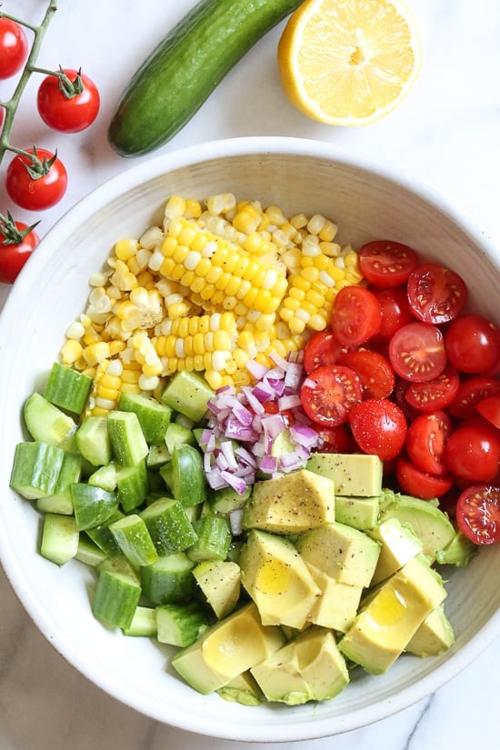 This Corn Tomato Avocado Salad is summer in a bowl! The perfect side dish with anything you're grilling, or double the portion as a main dish.