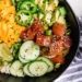 With marinated tuna, brown rice, avocado, cucumber, mango, macadamias and scallions, this Hawaiian style quick Ahi Poke Bowl is perfect for hot summer nights.