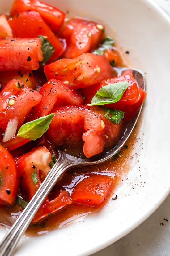 Ripe, end-of-summer garden tomatoes make the best, juiciest tomato salad, perfect served with a rustic loaf of bread!