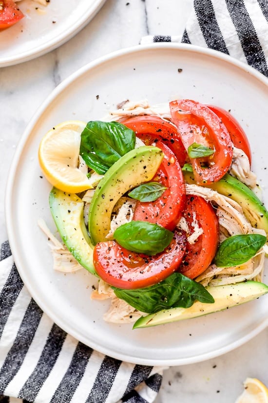 This quick and easy chicken salad is made with the breast meat of a Rotisserie chicken, avocados, fresh tomatoes, basil and lemon juice.