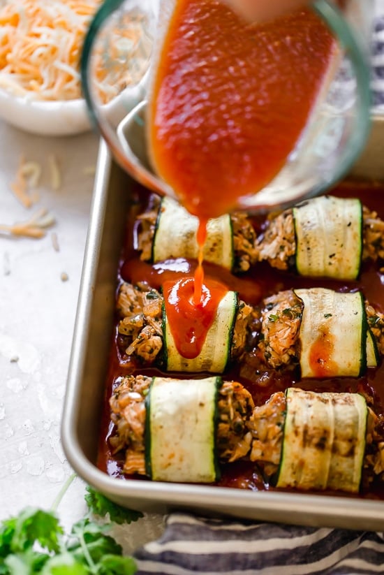 These Zucchini Chicken Enchilada Roll Ups are filled seasoned shredded chicken, topped with enchilada sauce and cheese. Delicious, and perfect for Keto, gluten-free or low-carb diets.