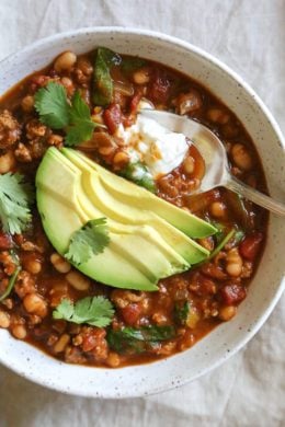 Turkey Pumpkin Chili is the perfect Fall dish made with ground turkey, tomatoes, canned pumpkin, white beans and spinach.