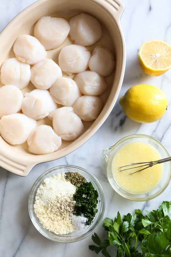 These quick and easy baked sea scallops are topped with panko and Parmesan in a simple lemon-butter sauce.