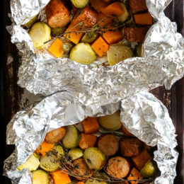 An easy Fall foil packet dinner made with spicy chicken Andouille sausage, Brussels sprouts and butternut squash. It's the perfect balance of spicy, smokey and sweet in every bite!
