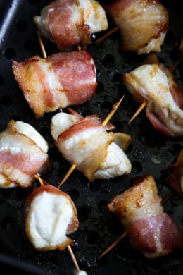 Bacon wrapped chicken bites are the easiest appetizer, made with just TWO ingredients. Using the air fryer, the bacon comes out crisp on the outside, and the chicken juicy and tender inside.
