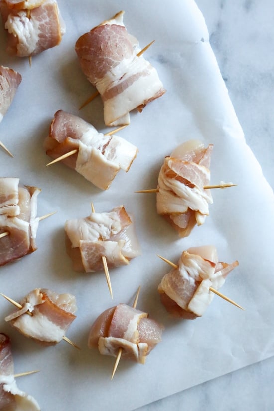 Bacon wrapped chicken bites are the easiest appetizer, made with just TWO ingredients. Using the air fryer, the bacon comes out crisp on the outside, and the chicken juicy and tender inside. 