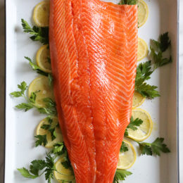 This simple Baked Salmon dish is made with fresh lemon, and lots of fresh herbs such as dill, parsley, chives.