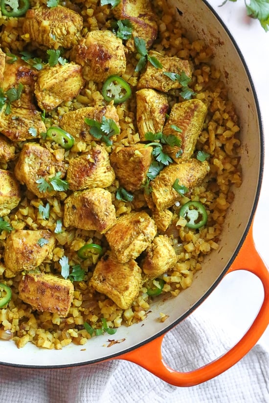 This quick and easy Indian-inspired skillet dish, is a low-carb take on Chicken Biryani, made with riced cauliflower in place of rice. It's also Keto, gluten-free and Whole30 compliant.