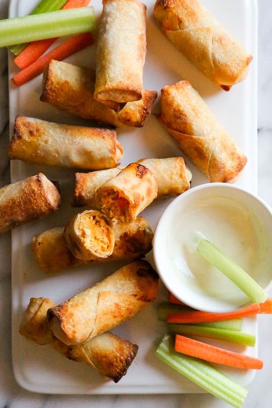 These Buffalo Chicken Egg Rolls, filled with shredded boneless chicken breast, hot sauce and blue cheese make the perfect appetizer! Bake them in the oven or air fryer!