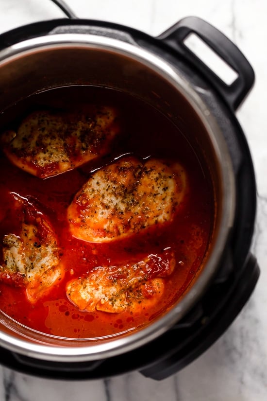 Cooked chicken breasts in tomato sauce in the Instant Pot