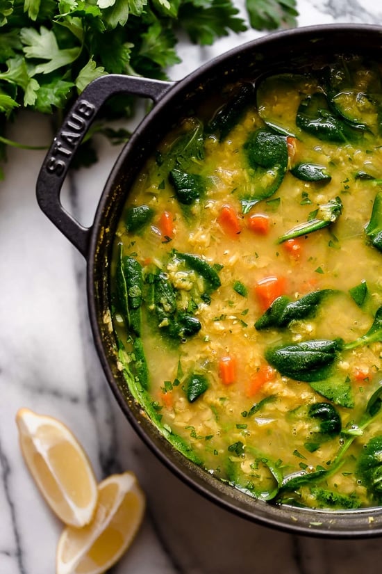 This delicious, Middle Eastern inspired Lentil Soup, made with red lentils, turmeric, spinach, carrots and lemon will exceed your expectations. It's golden in color, and very easy to make and leftovers are freezer-friendly.