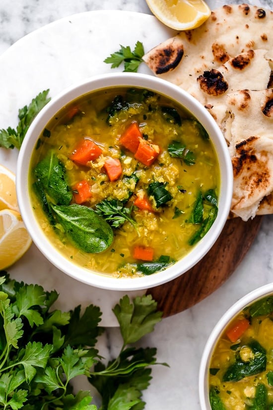 Red Lentil Soup with Spinach is a delicious, Middle Eastern inspired Lentil Soup, made with red lentils, turmeric, spinach, carrots and lemon. It's golden in color, and very easy to make and leftovers are freezer-friendly.