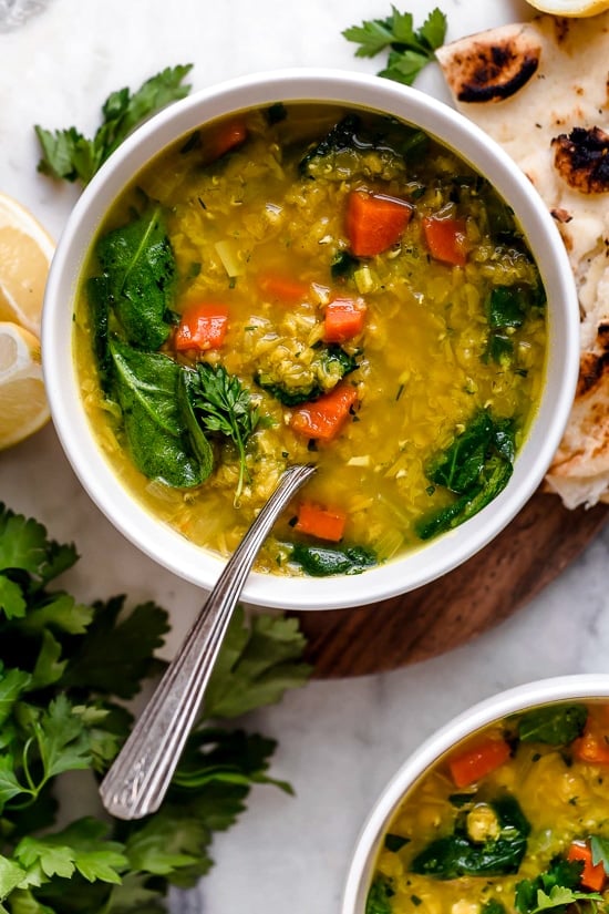 This delicious, Middle Eastern inspired Lentil Soup, made with red lentils, turmeric, spinach, carrots and lemon will exceed your expectations. It's golden in color, and very easy to make and leftovers are freezer-friendly.