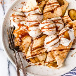 Banana Foster Crepes combine two of my favorite desserts – homemade crepes and bananas fosters! This slimmed down make-over is delicious and perfect anytime you're craving something sweet!
