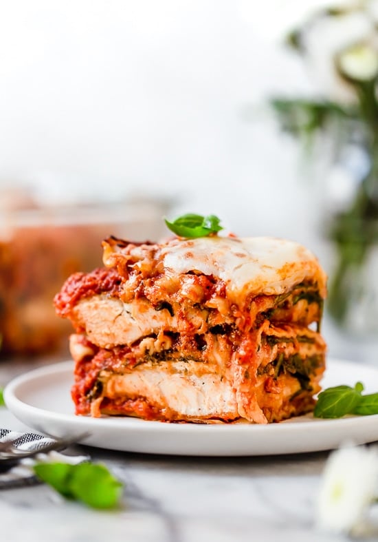 A slice of chicken parmesan lasagna on a plate