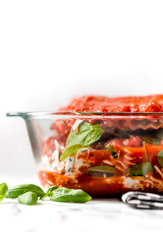 The outside of a casserole dish with chicken parm lasagna
