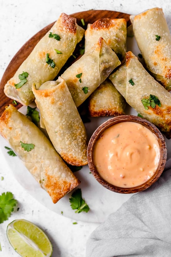 These Avocado Egg Rolls are inspired by the Cheesecake Factory egg rolls, only healthier because they are not fried. An easy air fryer recipe or bake them in the oven!