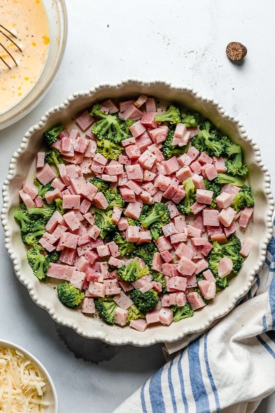 This low-carb Quiche is light and delicious, perfect for breakfast or brunch (or even a light dinner)! Made with a leftover ham or ham steak, broccoli and Swiss Cheese.
