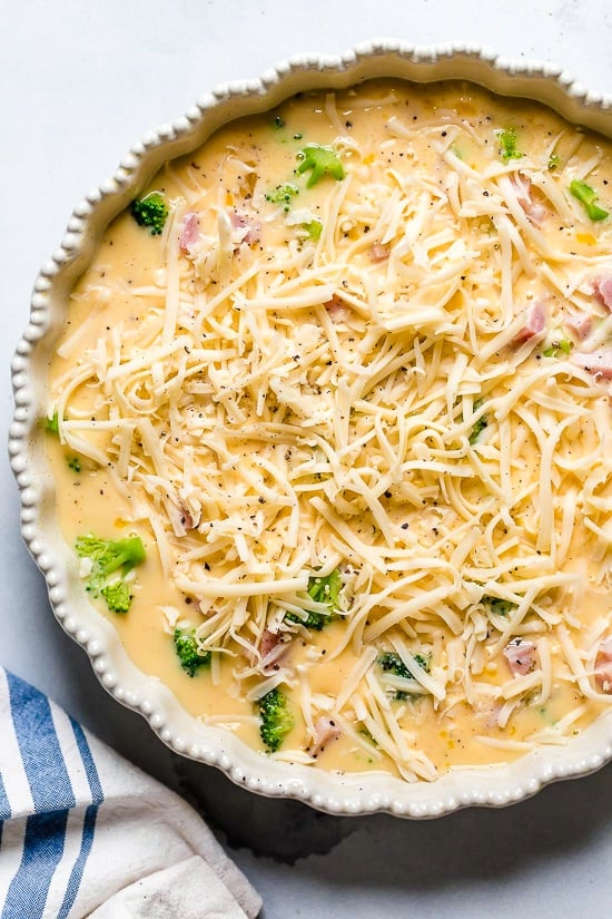This low-carb Quiche is light and delicious, perfect for breakfast or brunch (or even a light dinner)! Made with a leftover ham or ham steak, broccoli and Swiss Cheese.