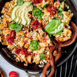 Migas is a popular Tex Mex egg dish made with chopped corn tortillas, cheese, tomatoes, jalapeños, and onions. I serve it plated with tortillas on the side, but they can also be wrapped in a tortilla, taco style.
