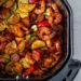 This fast and easy Air Fryer Cajun Shrimp recipe is a meal-in-one, made with shrimp, sausage, and lots of colorful vegetables such as zucchini, yellow squash and bell peppers.