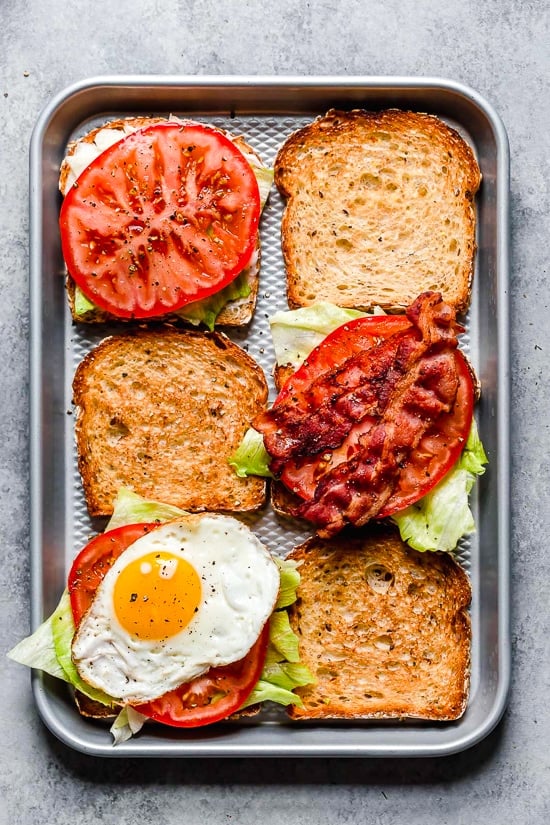 Breakfast BLT made with center cut bacon, lettuce, tomato and egg on whole wheat bread.