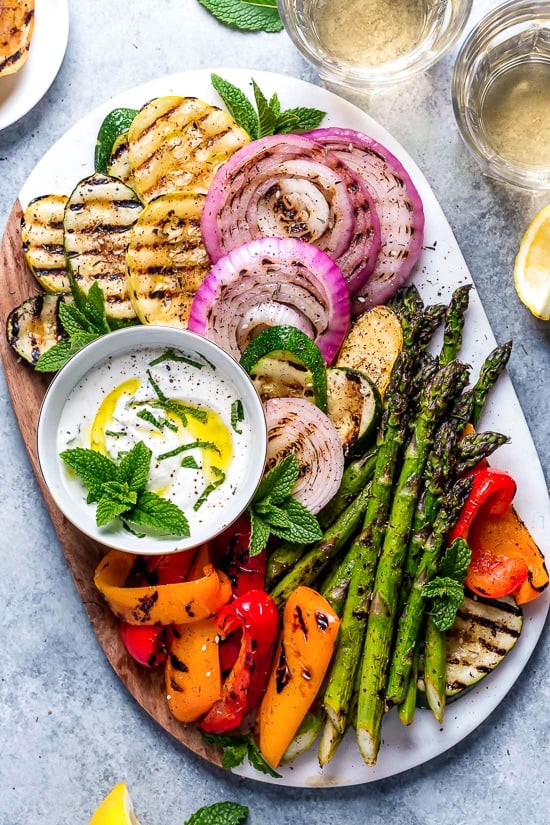 Grilled Vegetables with Yogurt Mint Sauce are so colorful and delicious. An easy summer side dish made with asparagus, zucchini, squash, red onion and bell peppers.
