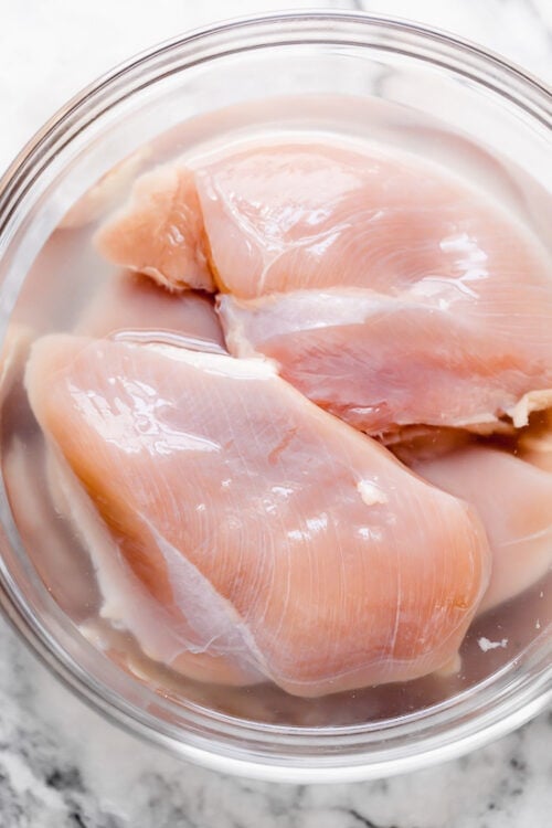Brining chicken breast in a salt solution for the juiciest, most flavorful results.