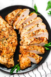 chicken breasts sliced on a plate