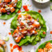 These easy, low-carb Buffalo Shrimp Lettuce Wraps are spicy, light and delicious topped with celery and blue cheese or ranch dressing.