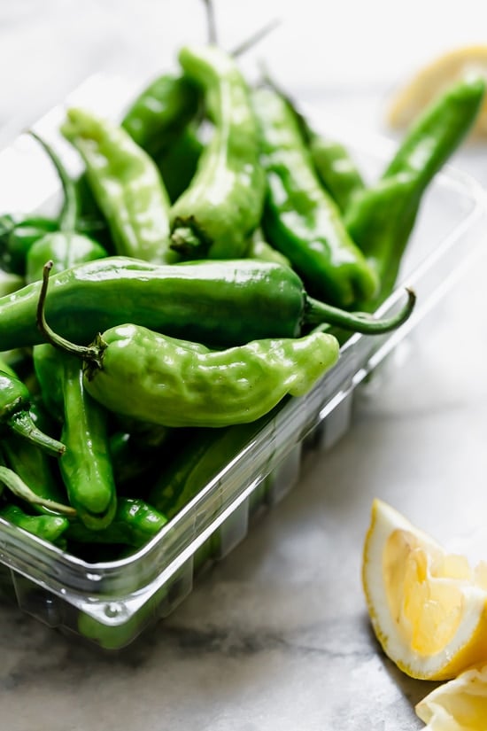 Air Fried Shishito Peppers come out charred and blistered with the air fryer, which uses much less oil! A squeeze of lemon over the top and they are delicious!