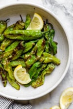 Air Fried Shishito Peppers come out charred and blistered with the air fryer, which uses much less oil! A squeeze of lemon over the top and they are delicious!