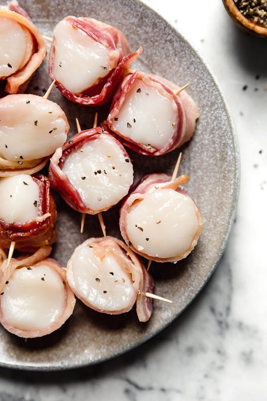 Air Fryer Bacon Wrapped Scallops are so easy, made with just two ingredients! Elegant enough to impress guests yet easy enough to make any weeknight for your family.