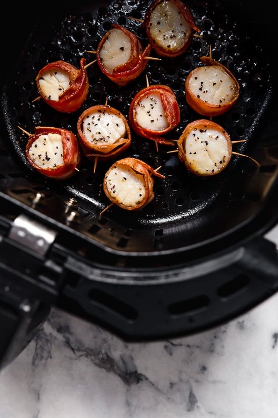 Air Fryer Bacon Wrapped Scallops are so easy, made with just two ingredients! Elegant enough to impress guests yet easy enough to make any weeknight for your family.