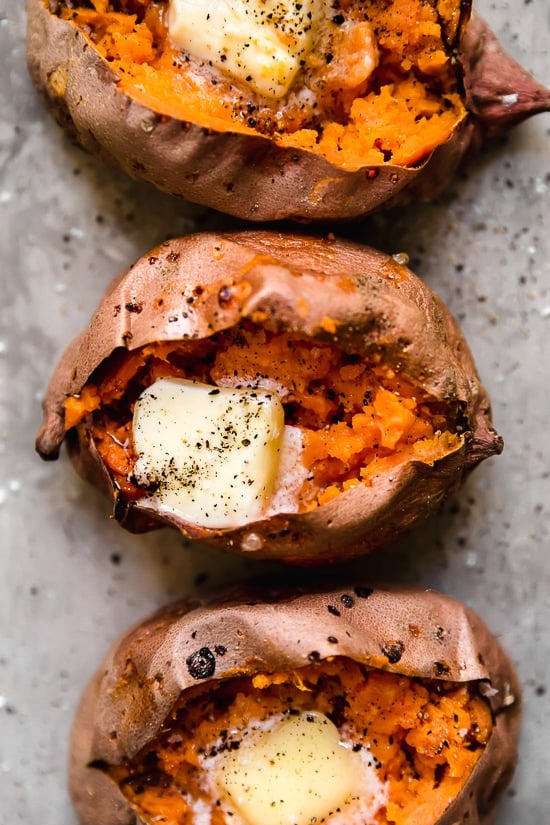 Making a Baked Sweet Potato in the oven is so easy and comes out perfectly sweet and fluffy on the inside with this foolproof recipe.
