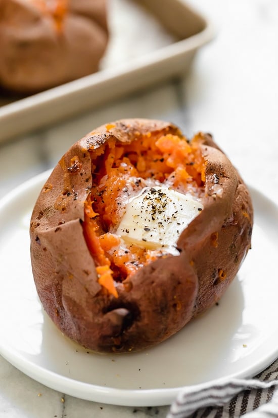 Baked Sweet Potatoes in the oven are so easy and come out perfectly sweet and fluffy on the inside with this foolproof recipe.