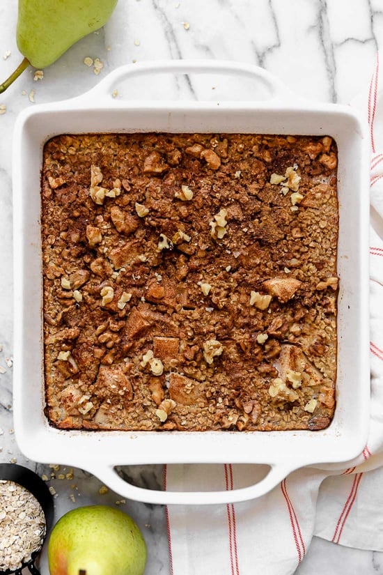 Baked oatmeal is like having dessert for breakfast! Made with healthy ingredients—bananas, pears, oats, nuts and maple syrup, it will leave you satisfied all morning.