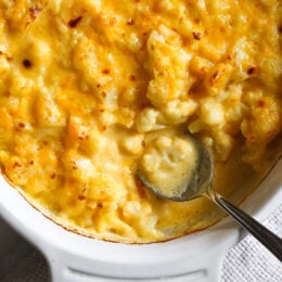 This cheesy Baked Cauliflower "Mac" and Cheese is perfect when you're craving mac and cheese without the pasta! It's lower in carbs and filled with protein and veggies!